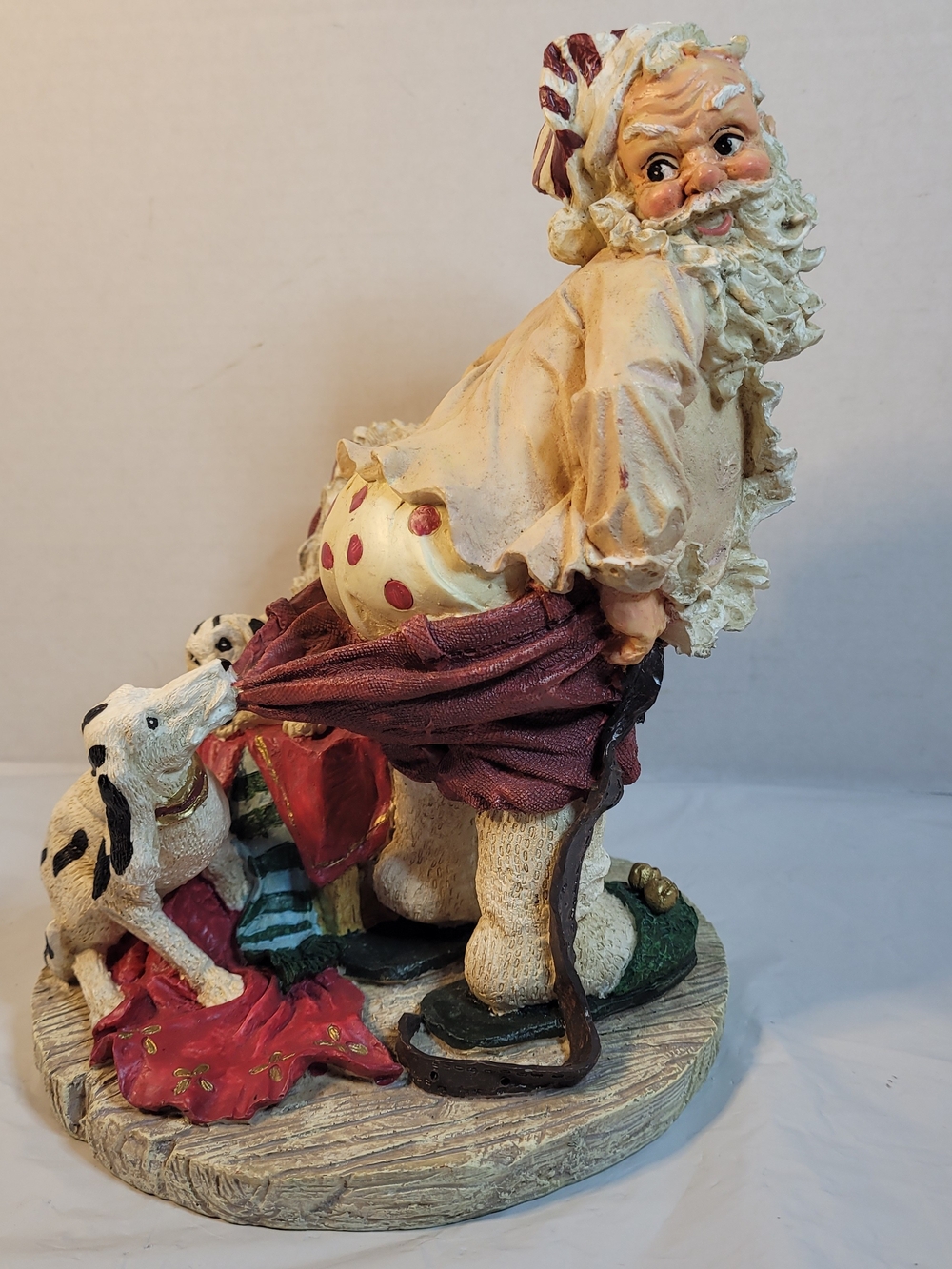 Santa W/ Dogs Pulling On His Drawers 10” resin figurine  Christmas (A4)